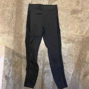 Fabletics black leggings with sheer side detail and pockets